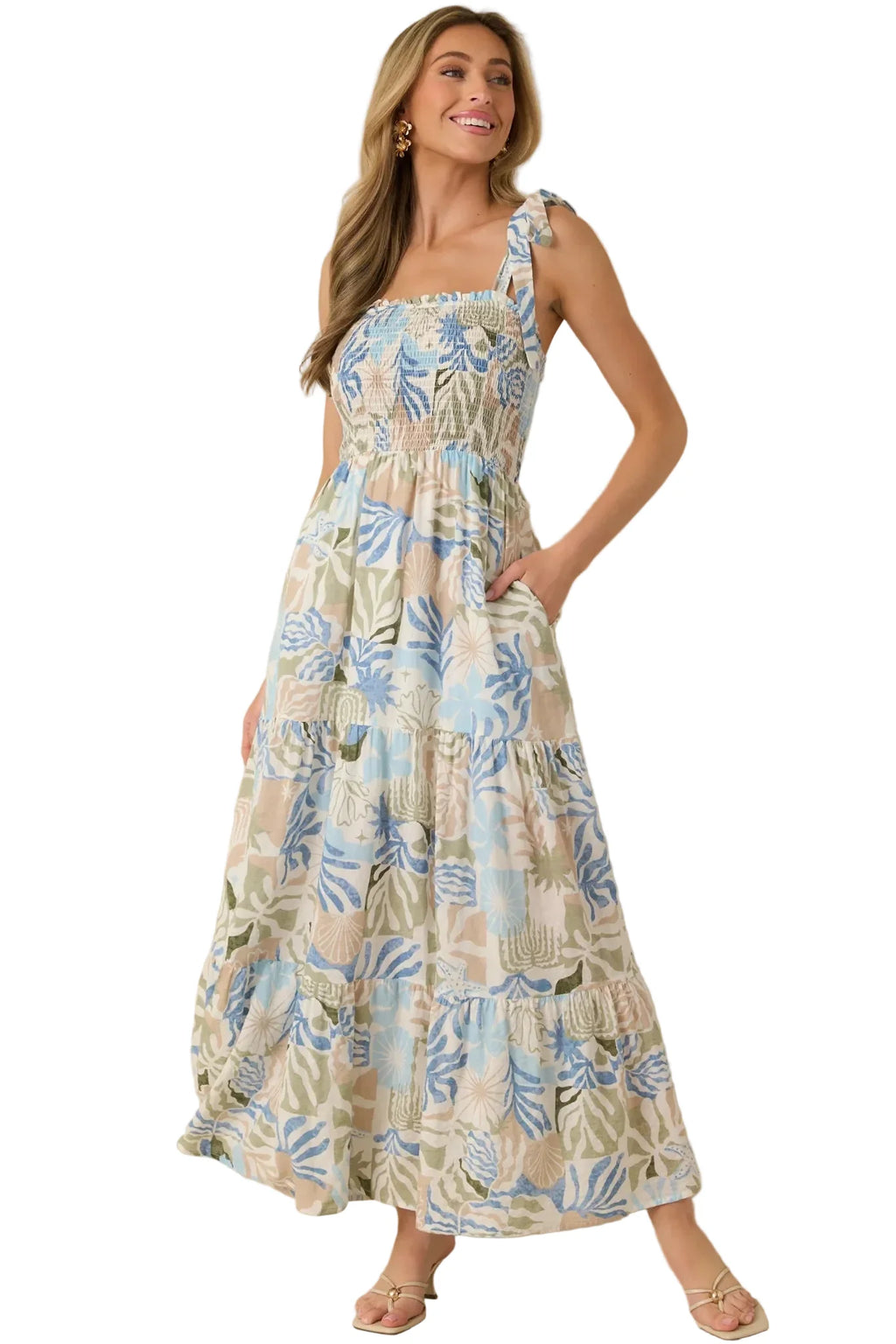Woman wearing a floral dress against a beige background
