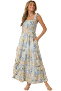 Woman wearing a floral dress against a beige background