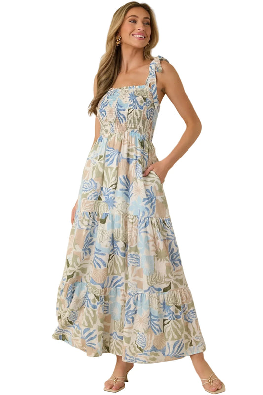 Woman wearing a floral dress against a beige background