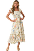 Woman wearing a floral dress against a plain background